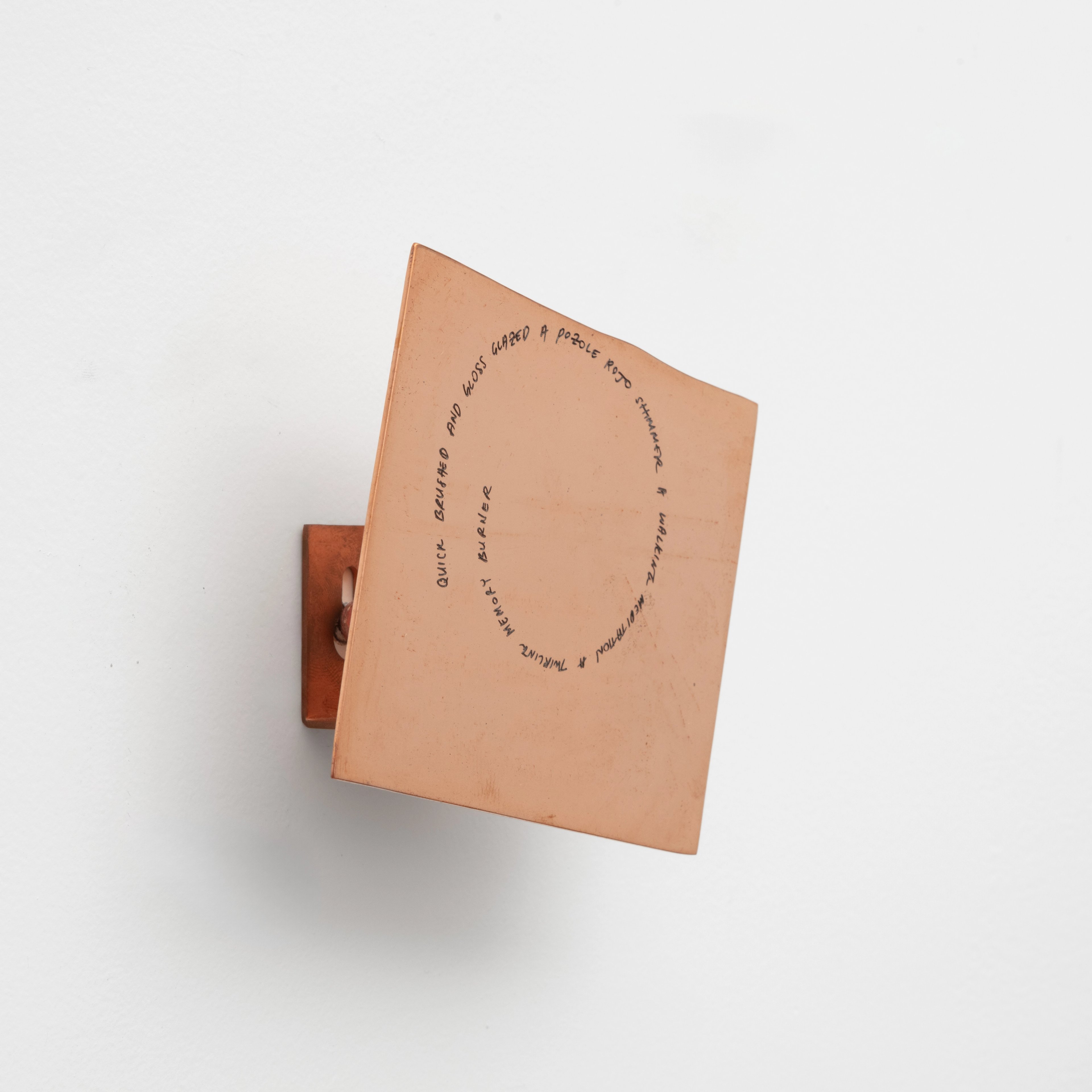 The copper hook begins where JB’s ceramic plate ends. 