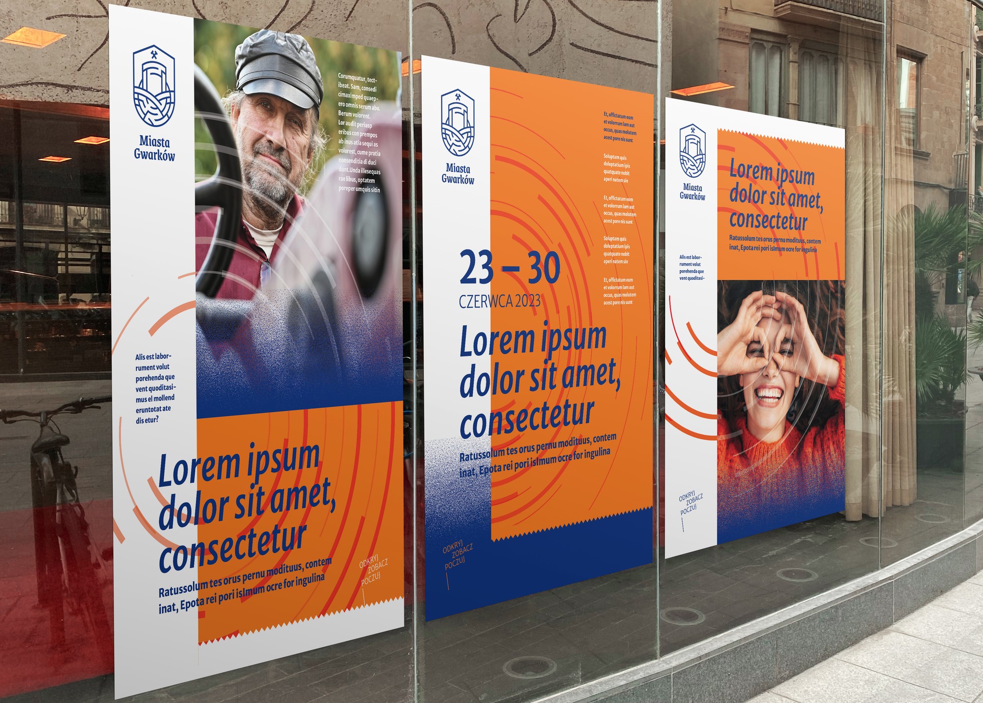 Three Miasta Gwarków posters behind the glass of a street display