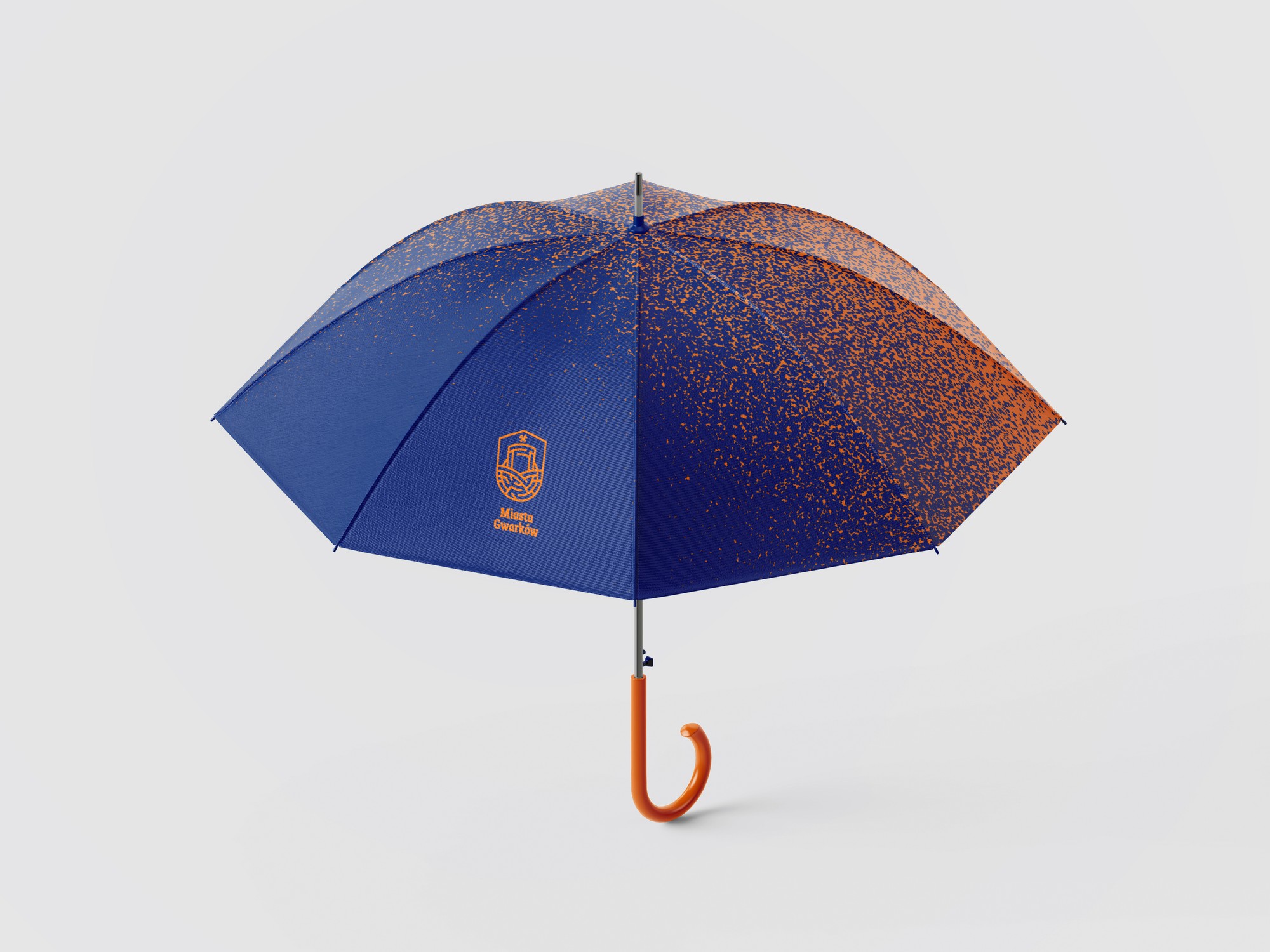 A navy umbrella with an orange gradient, the logo and an orange handle