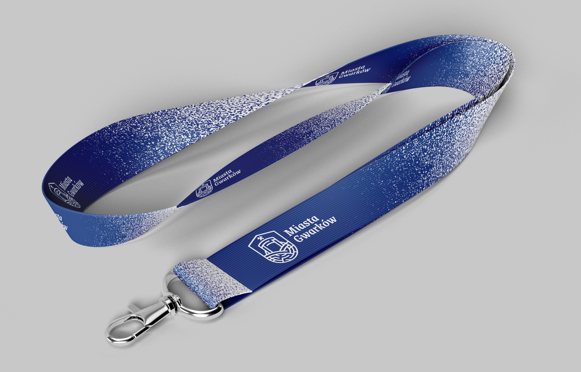 A navy lanyard with gradient texture, a white logo and a metal clasp