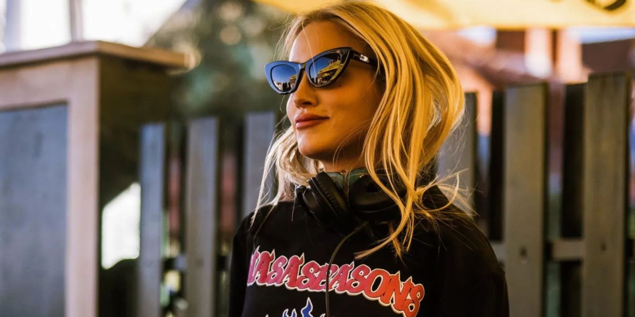Stella Bossi wearing sunglasses and headphones — Gray Area Academy feature hero image