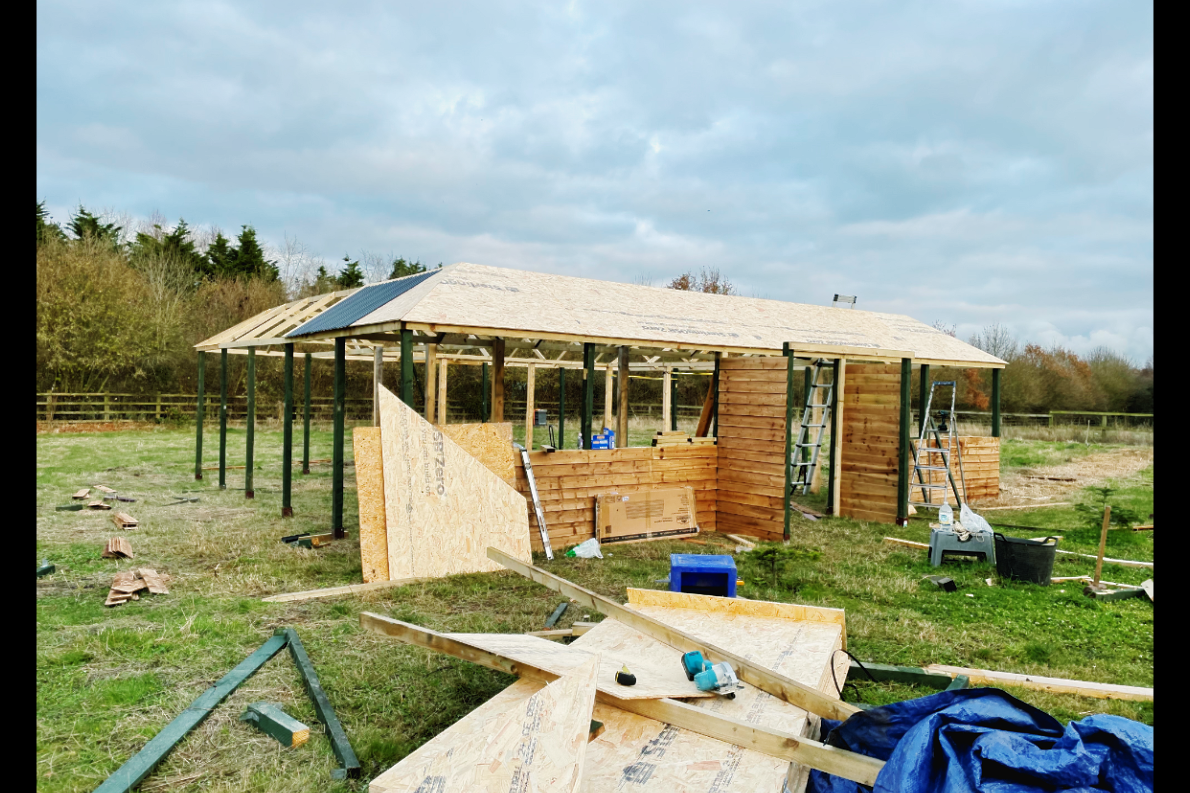 three pictures of a building under construction with a blue tarp on the ground