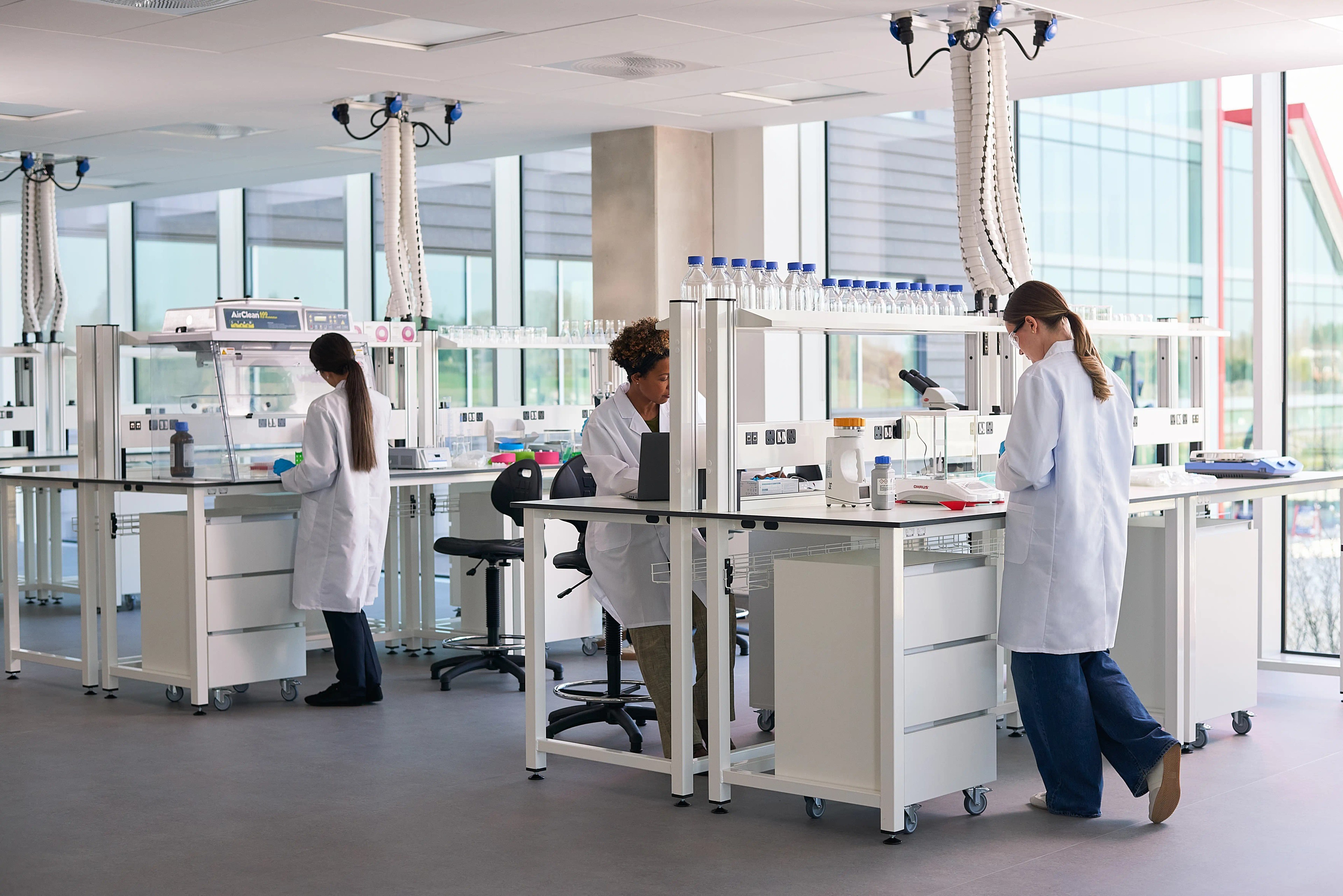 Three scientists at work in Oxford North's fitted labs.