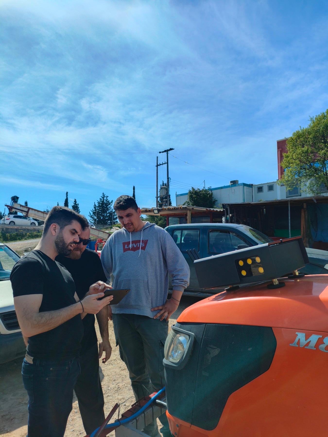 Field team inspecting Viewer on a tractor at Ktima Kir-Yianni