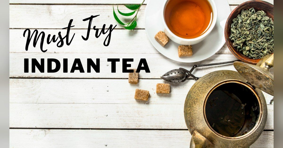Cup of Indian tea with loose tea leaves and sugar cubes