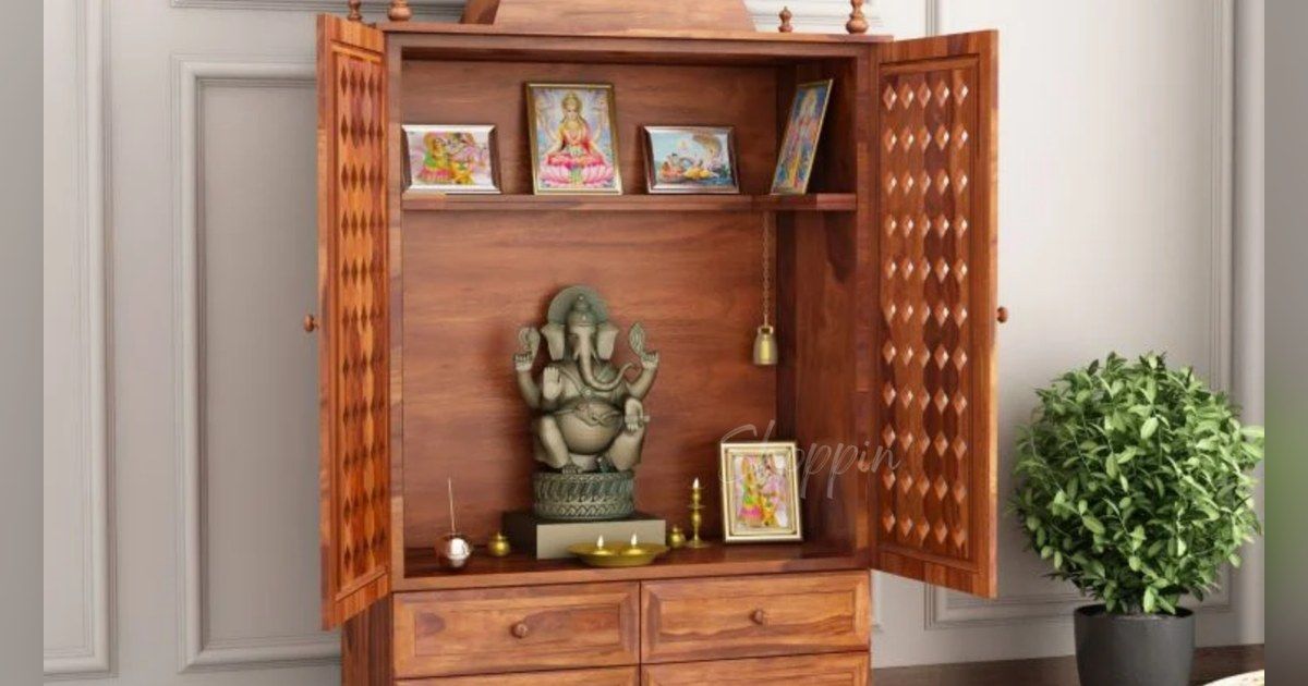 Carved wooden pooja mandir with a Ganesha idol