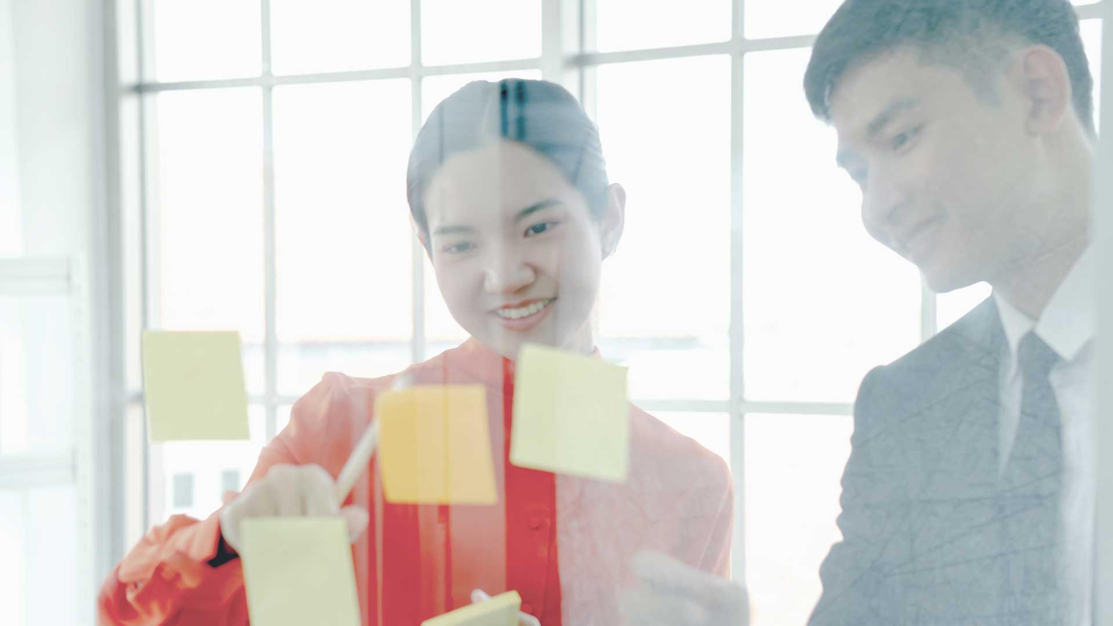 Two business people mapping Microsoft FY27 growth incentives