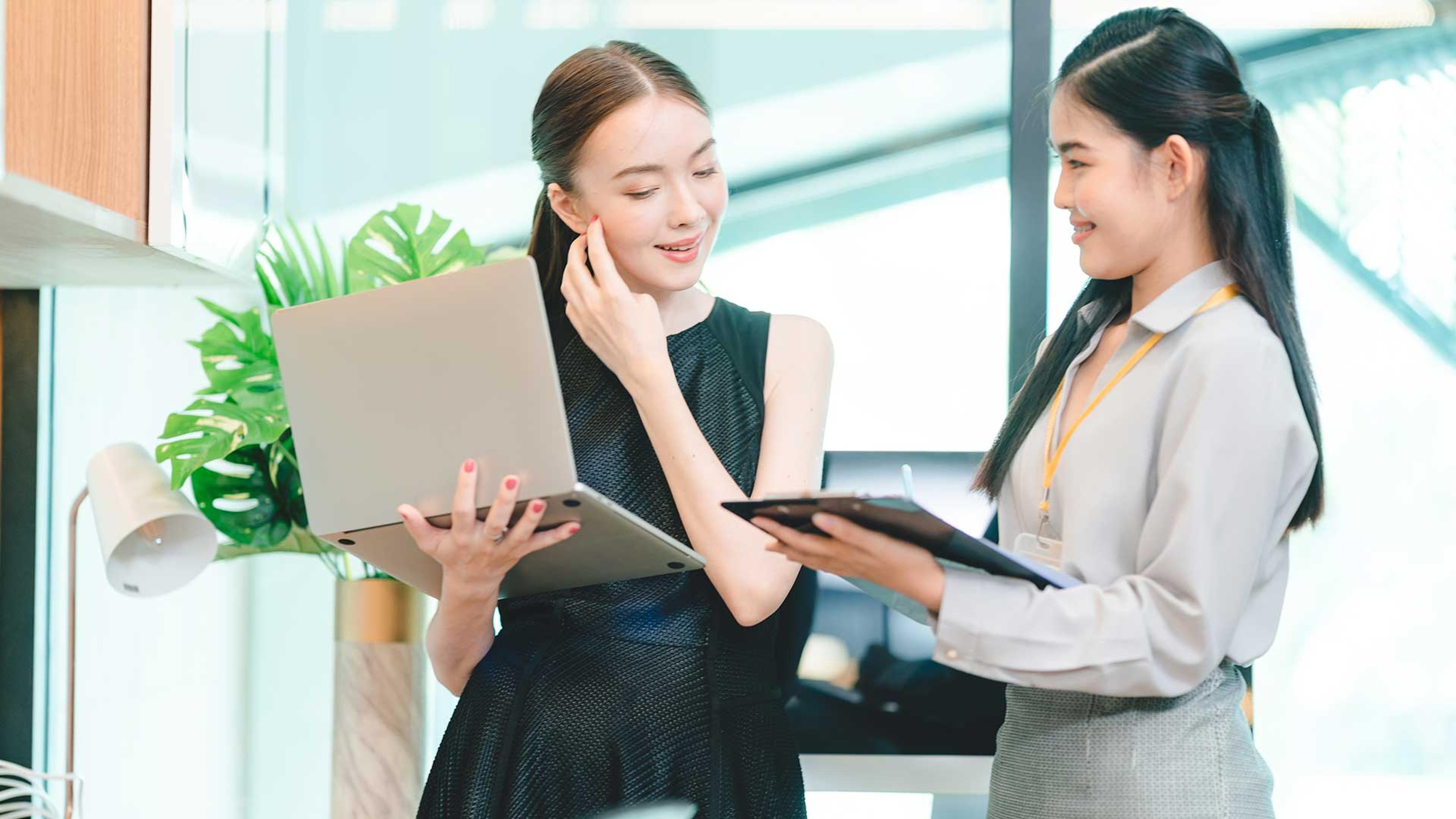 Two professions comparing notes with Copilot analyzing data