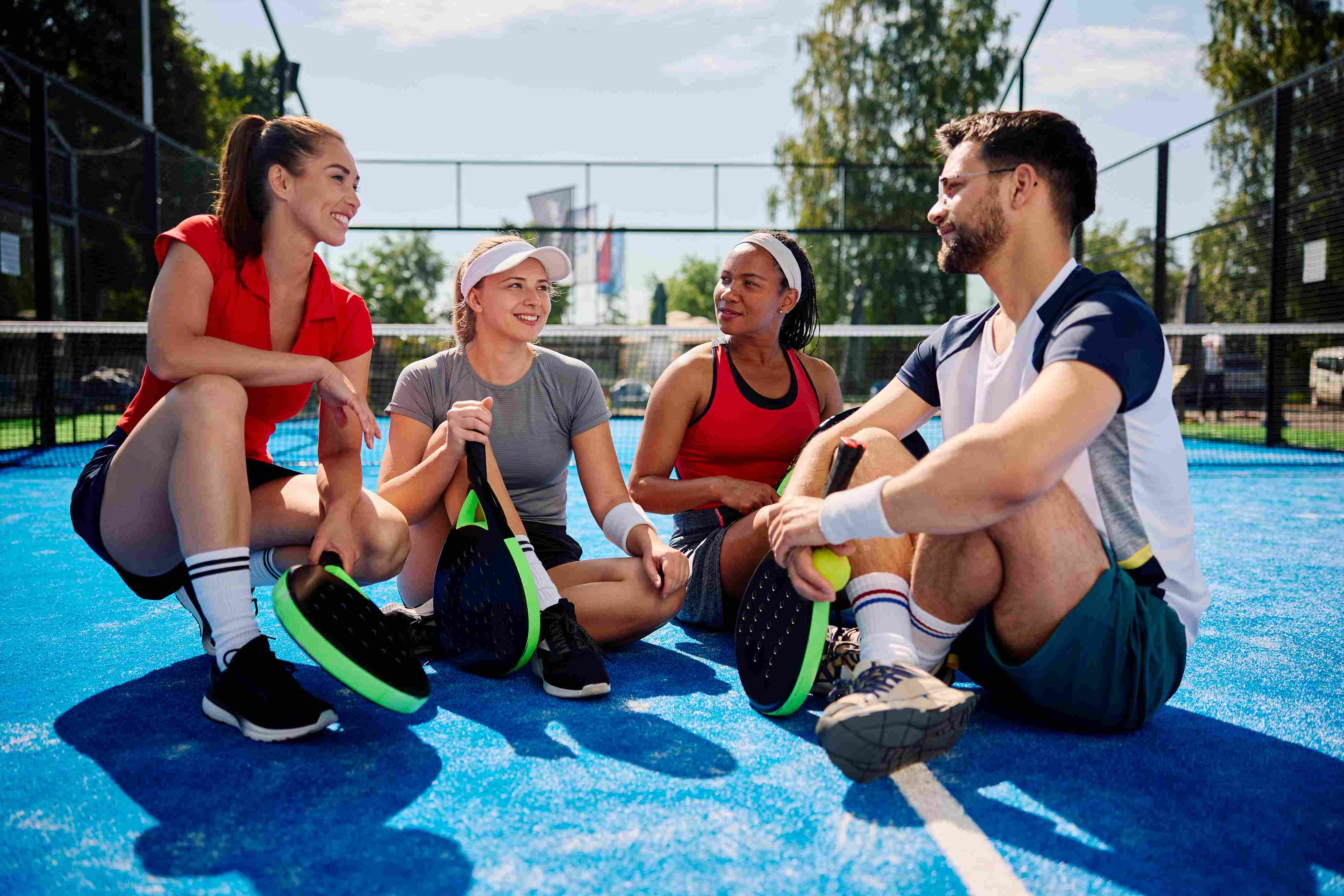 group of padel players having a conversation