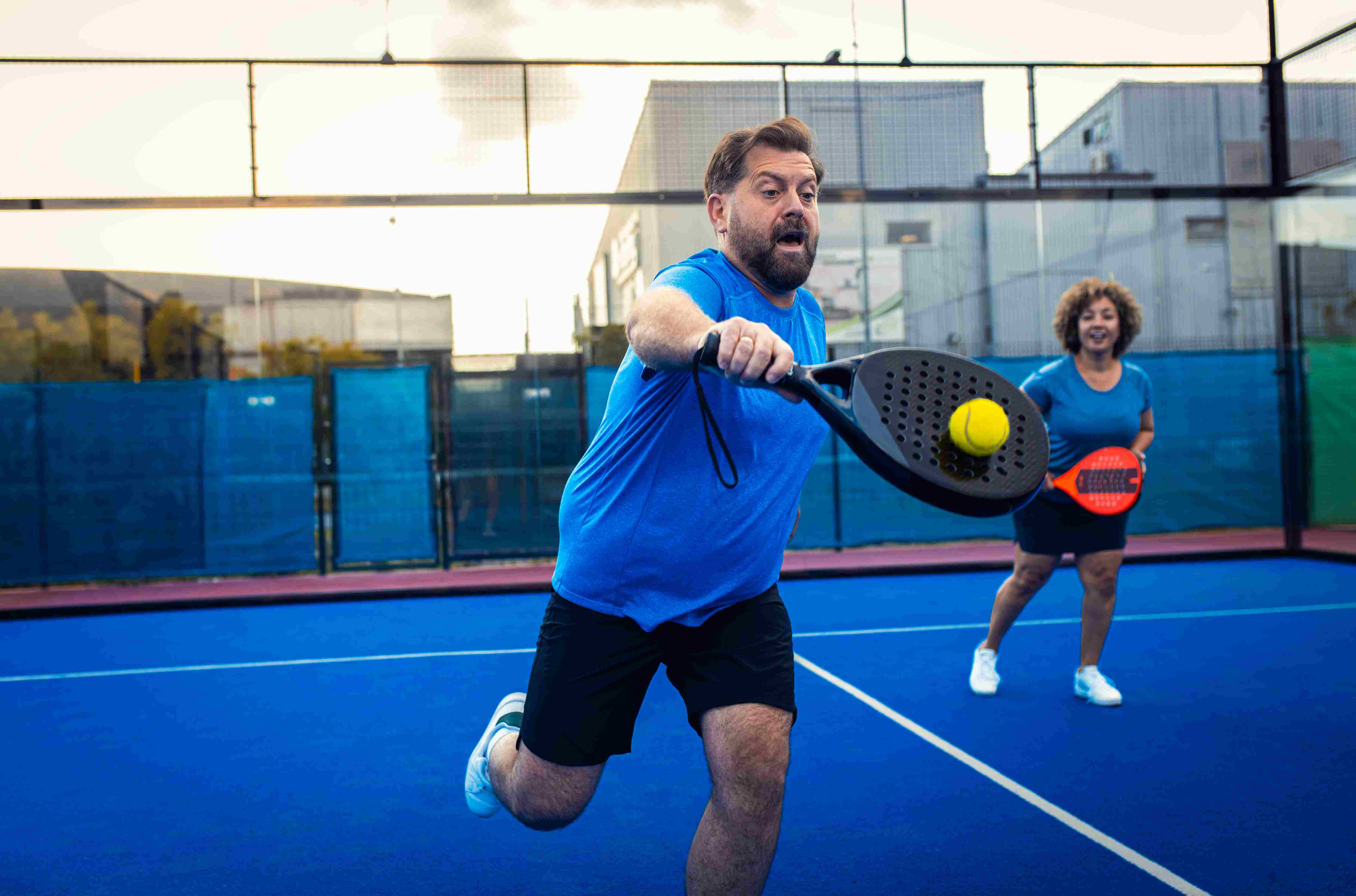adult players playing padel