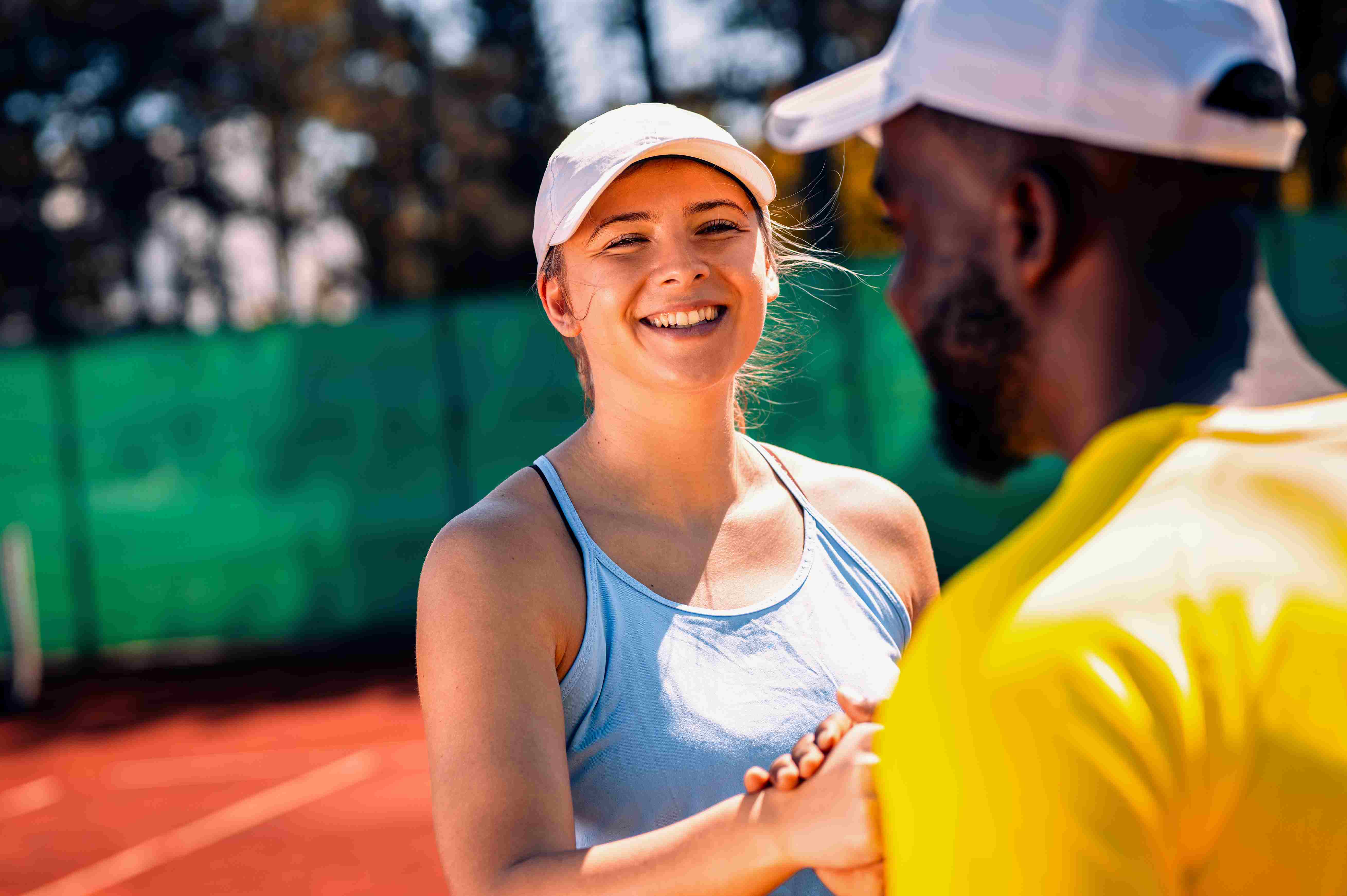 padel players giving hand shake