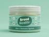 A jar of "Breed Health+" Skin & Immune System supplement powder for pets.