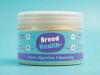 A supplement jar with a blue and purple label titled "Joints, Digestion & Immunity," centered against a vibrant cyan background.