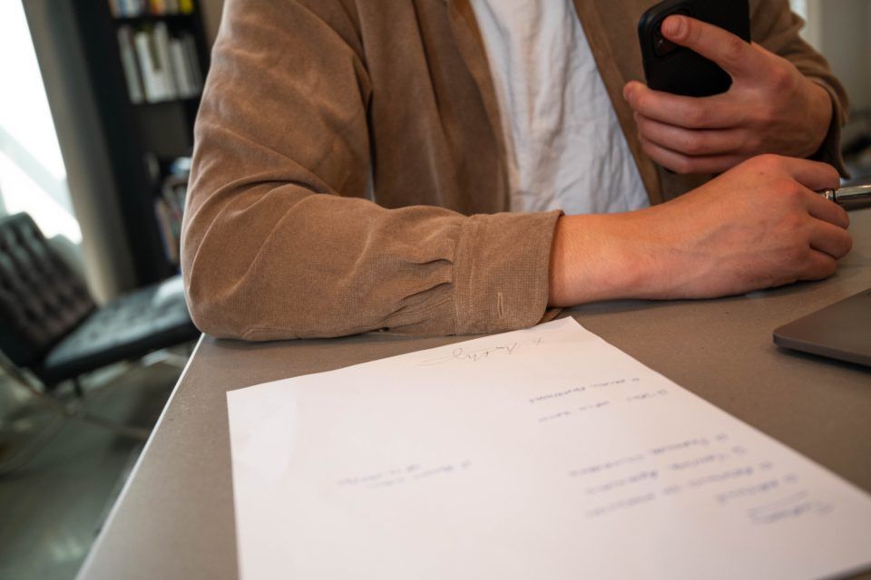 A consultant taking notes