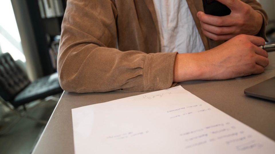 A consultant taking notes