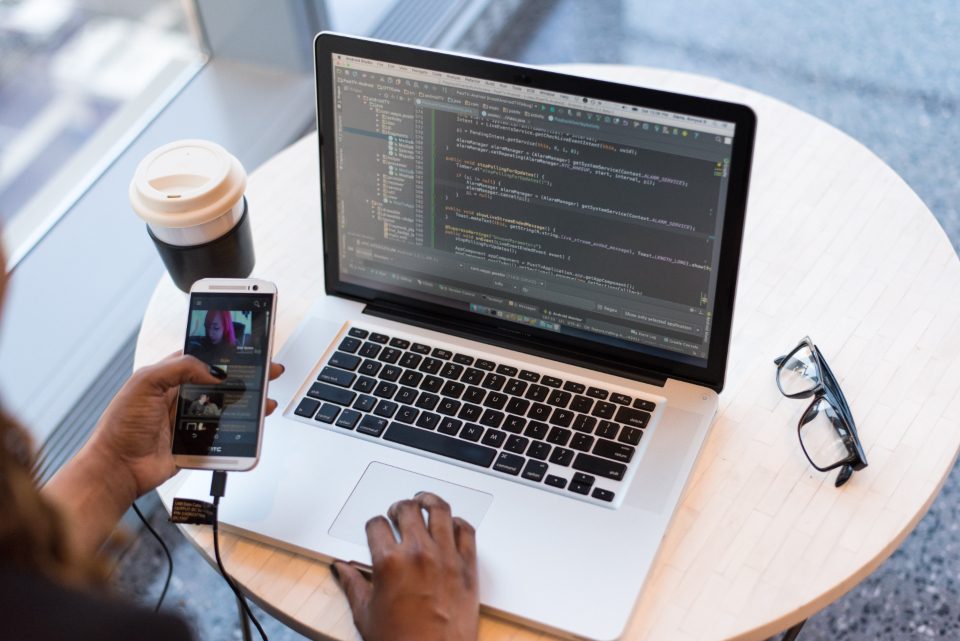 A developer working on a laptop