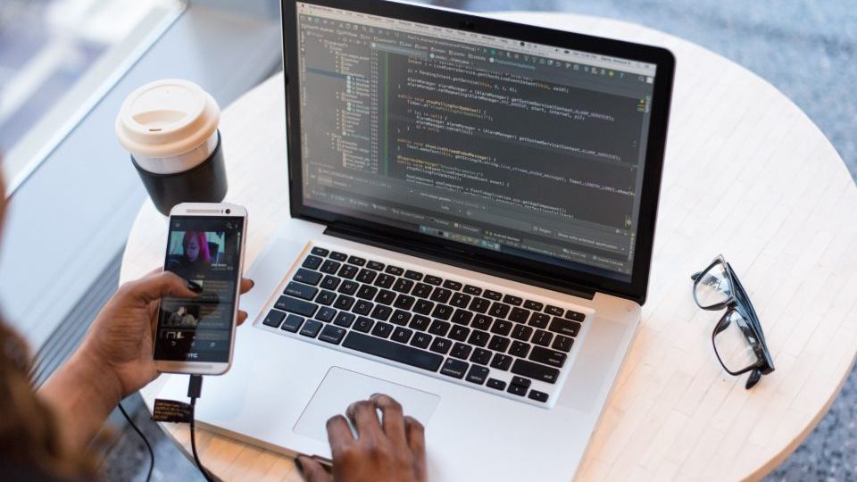 A developer working on a laptop