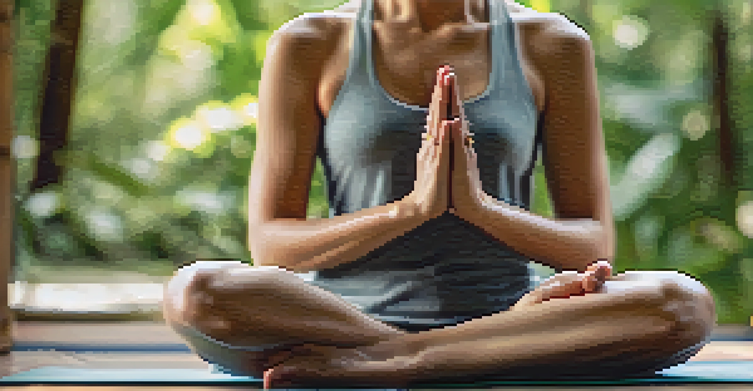 Close-up of hands in a mudra gesture on a yoga mat, with a blurred natural background.
