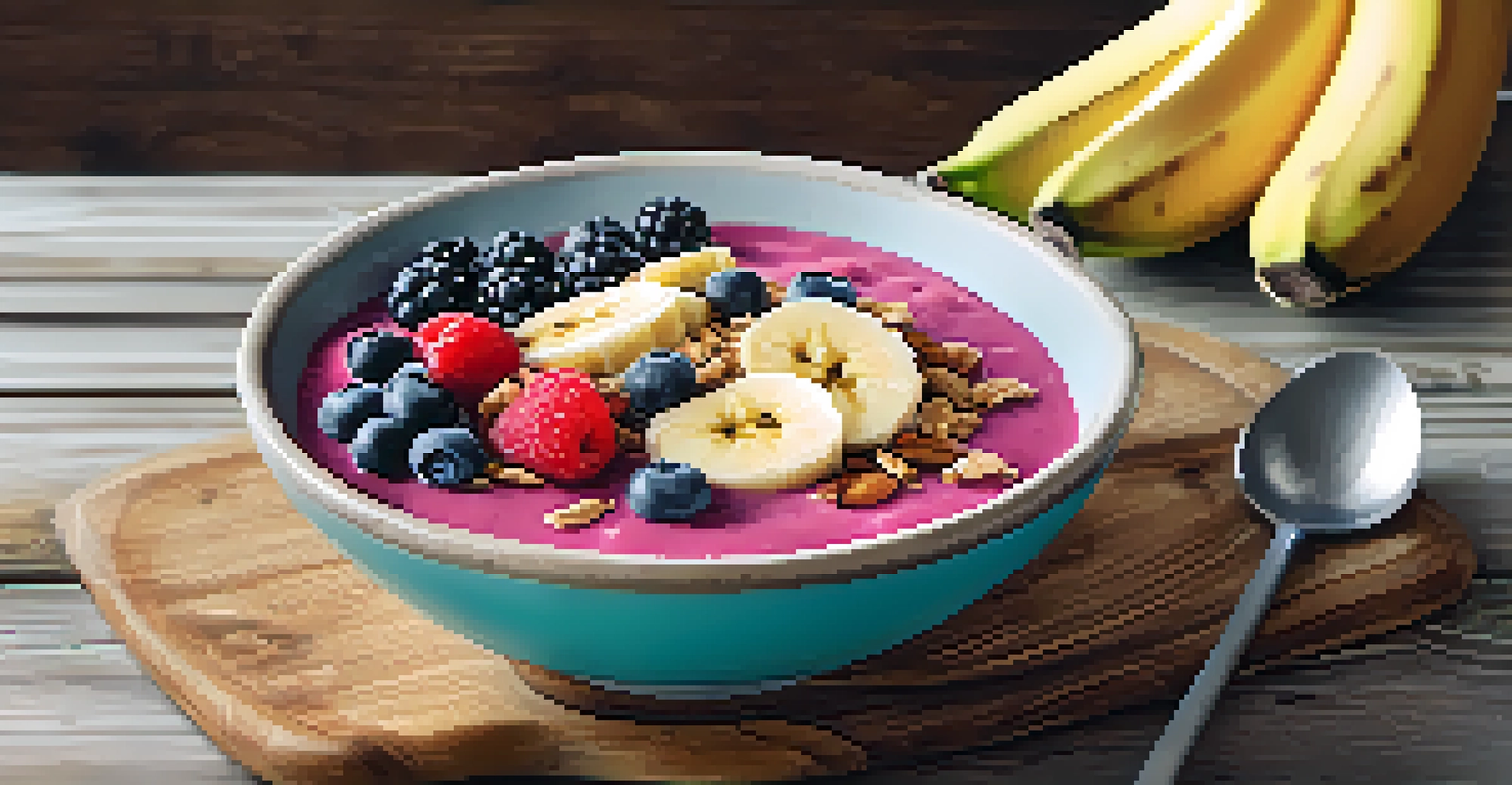 A colorful smoothie bowl with fruits and granola on a wooden table with a yoga mat in the background.