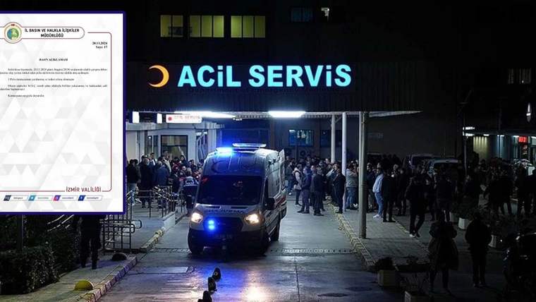 Acil servis önünde bekleyen bir ambulans ve kalabalık bir grup insan.
