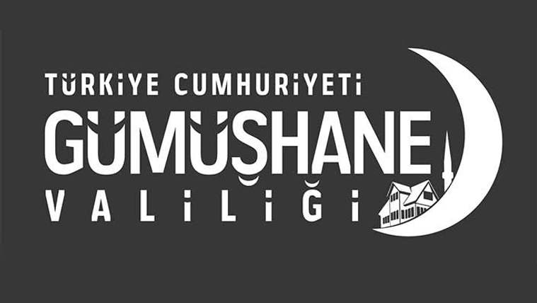 Koyu zemin üzerinde Türkiye Cumhuriyeti Gümüşhane Valiliği yazısı, ay ve bina simgesiyle birlikte yer alıyor.