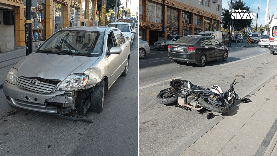 Yolda devrilmiş bir motosiklet ve hasar görmüş bir otomobil duruyor.