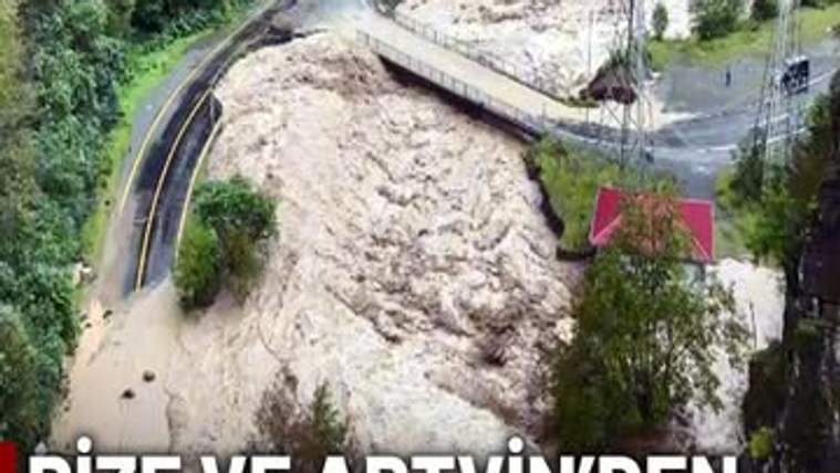 Çamurlu sel sularıyla kaplanan vadide bir köprü ve iki yol, çevresinde ağaçlar görülüyor.