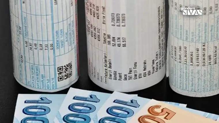 Üzerinde elektrik faturası bilgileri bulunan kağıtlar ve 100 ile 50 Euro banknotları.