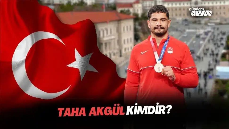Taha Akgül, madalya tutan bir sporcu, arka planda Türk bayrağı ve şehir manzarası var.
