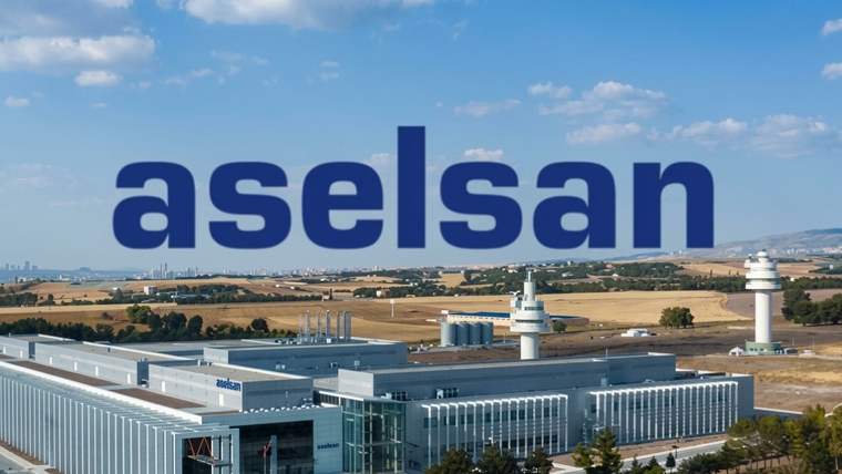 Önde büyük ASELSAN yazısı, arkasında geniş bir sanayi tesisi ve kurak tepeler görülüyor.