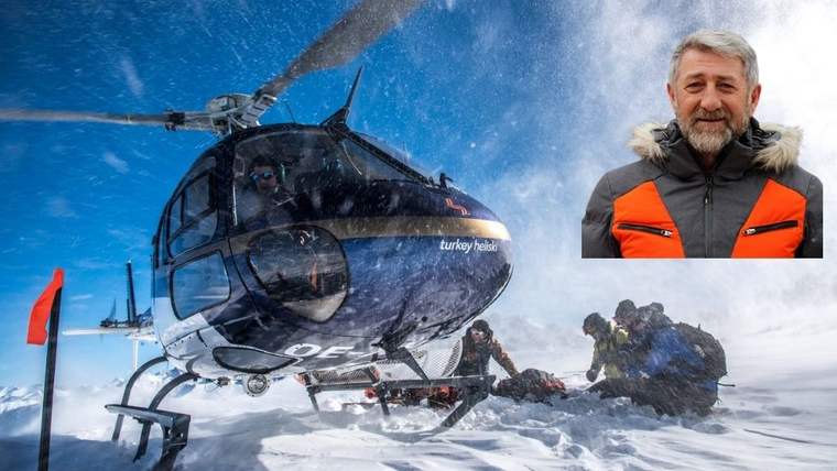 Karla kaplı dağlık alanda bir helikopter, etrafında kayak ekipmanlarıyla birkaç kişi bulunuyor.