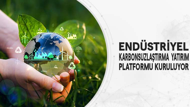 Bir el, yeşil yaprakların üzerinde şeffaf bir küreyi tutuyor; kürede enerji santralleri ve ağaçlar görünüyor.