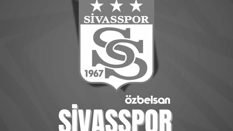 Gri zemin üzerinde üç yıldızlı Sivasspor arması ve altında Özbelsan Sivasspor yazısı bulunuyor.