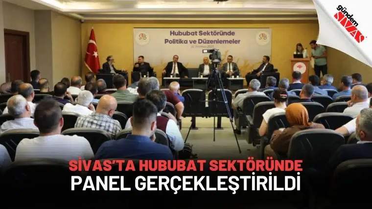 Bir panelde oturumda oturan altı kişi, arka planda Türk bayrağı ve Sivas Ticaret Borsası logosu var.