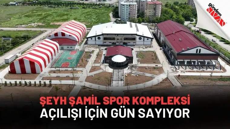 Şeyh Şamil Spor Kompleksi'nin dış görünümü, çevresinde yeşil alanlar ve binalar var.