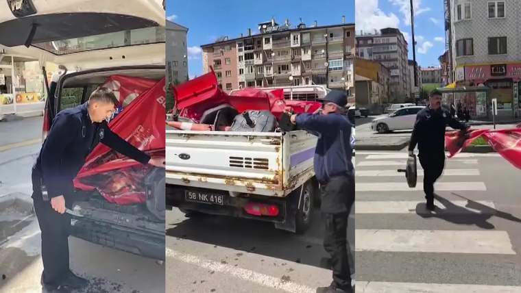 Zabıta ekipleri, kaldırımlardan toplanan işgallerin yüklü olduğu bir kamyonetin arkasında çalışıyor.