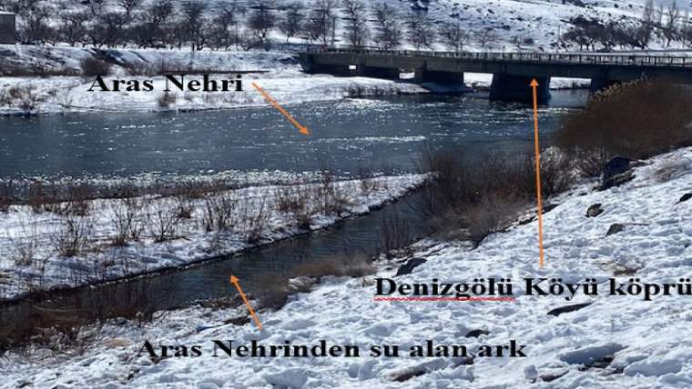 Aras Nehri'nin kenarında, karla kaplı bir alan ve köprü görünmektedir.