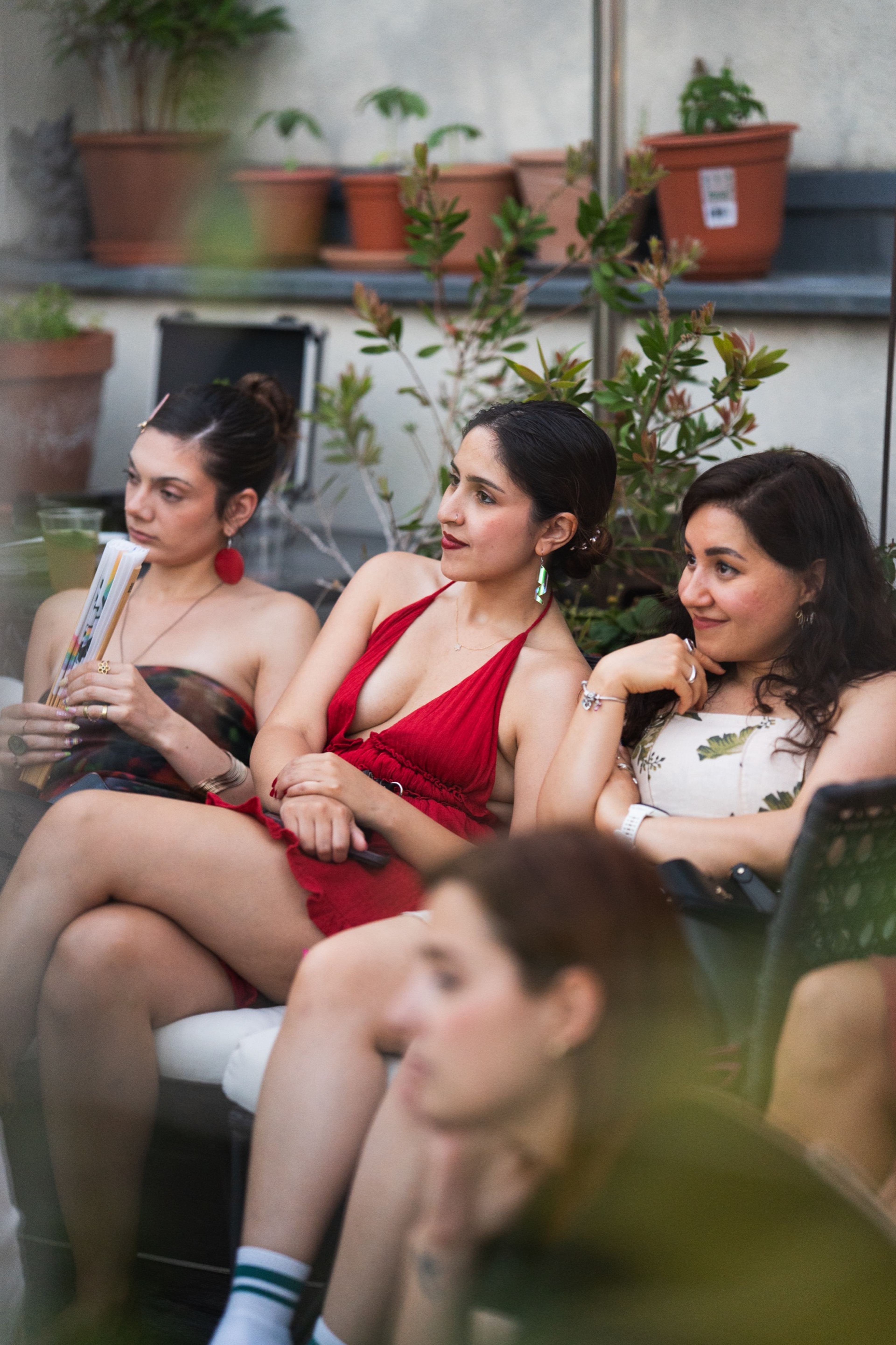 Guests seated together watching the concert on a Berlin rooftop
