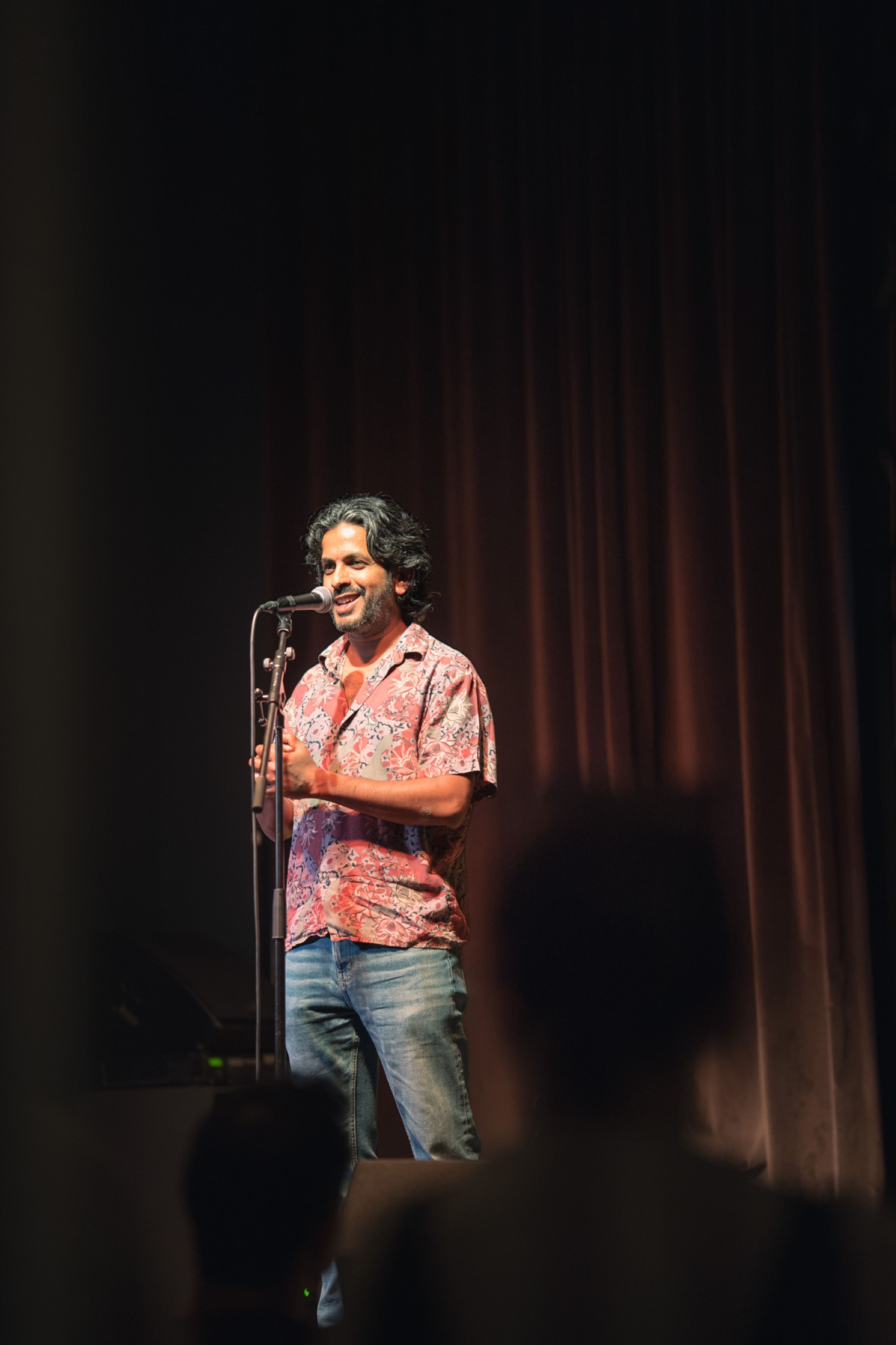 Speaker telling a story into the microphone