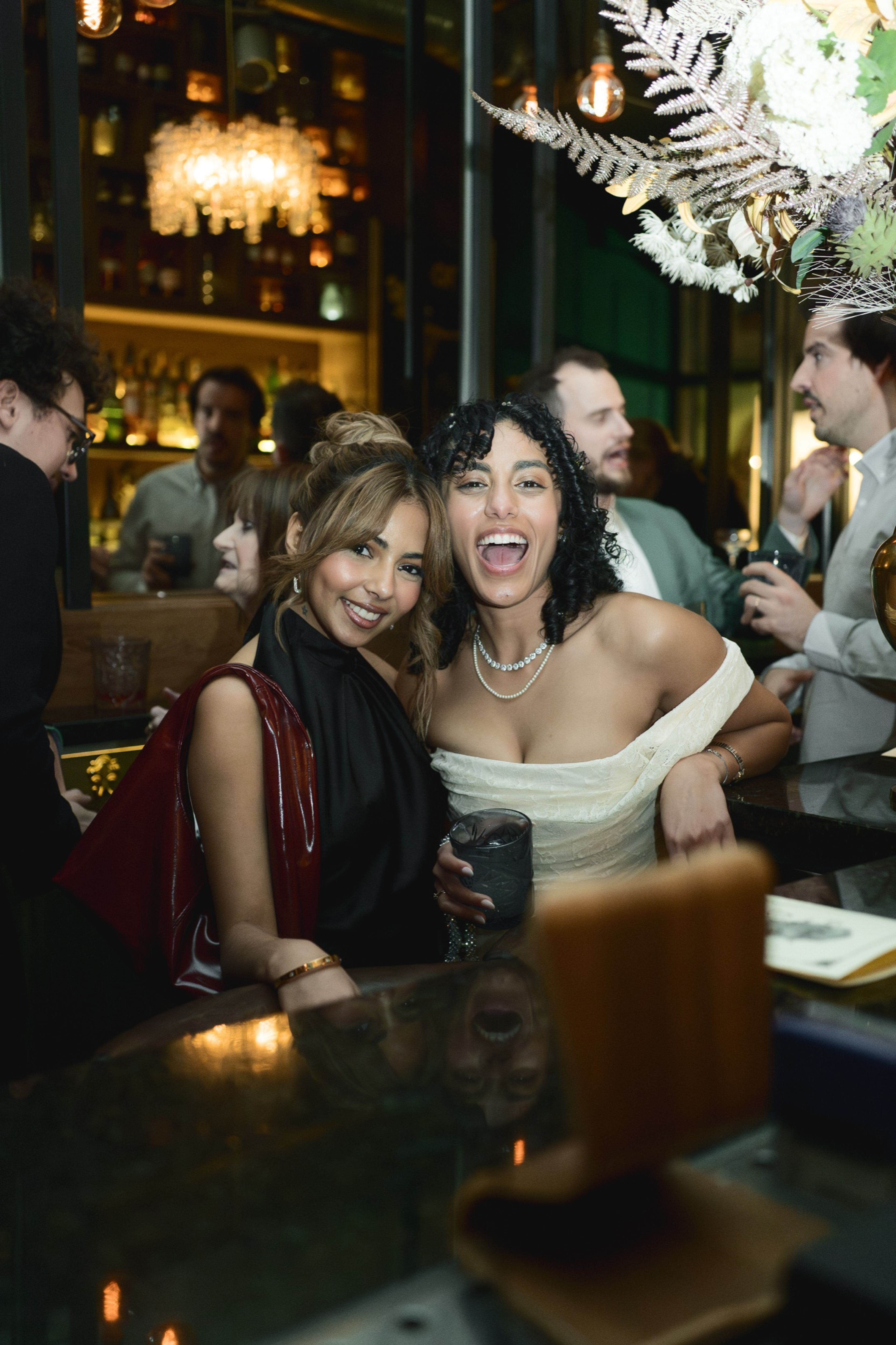 Two friends laughing together at the table