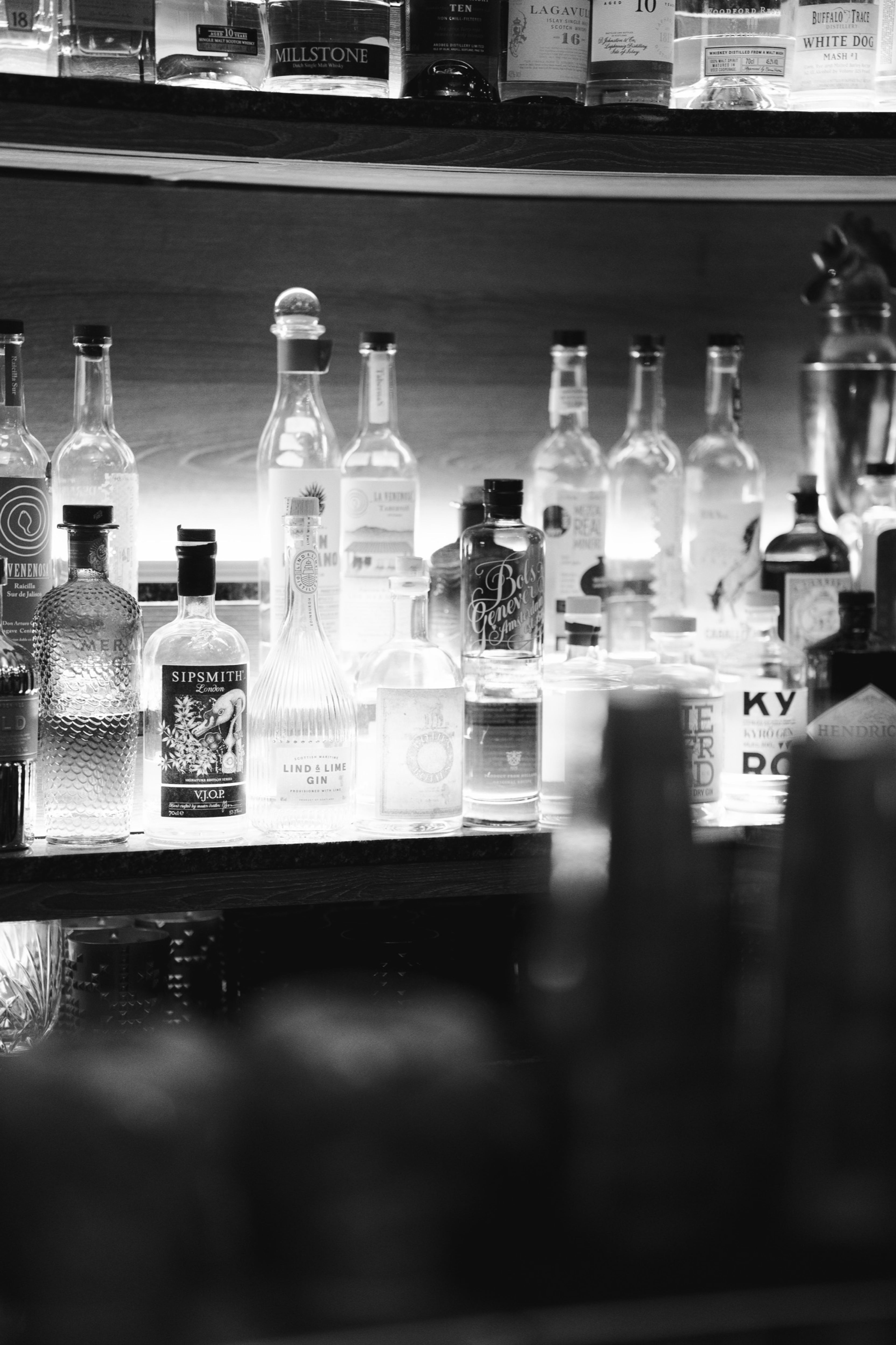 Bottles lined up along the bar