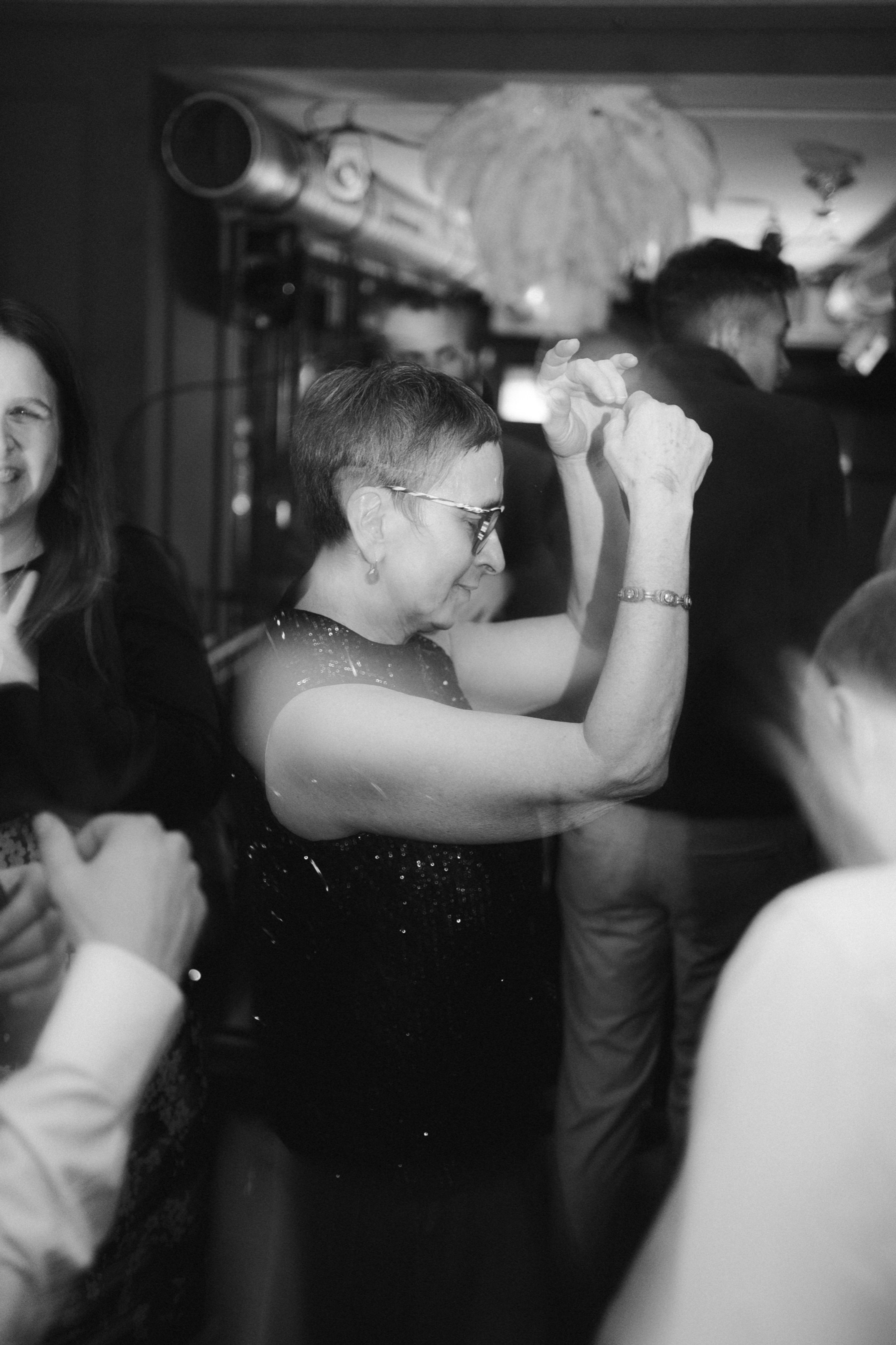 A couple dancing close in low light