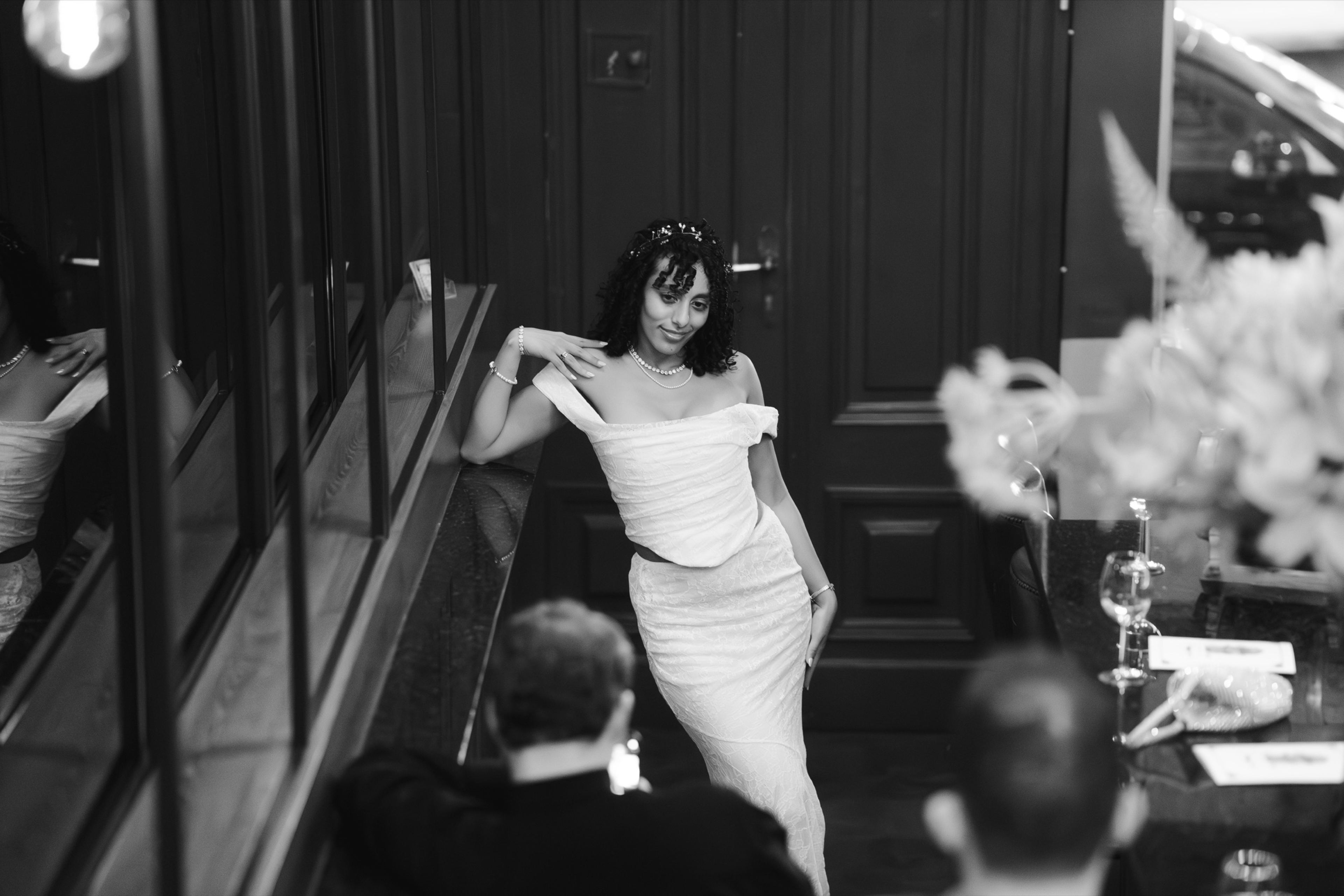 A guest twirling on the dance floor in a white dress