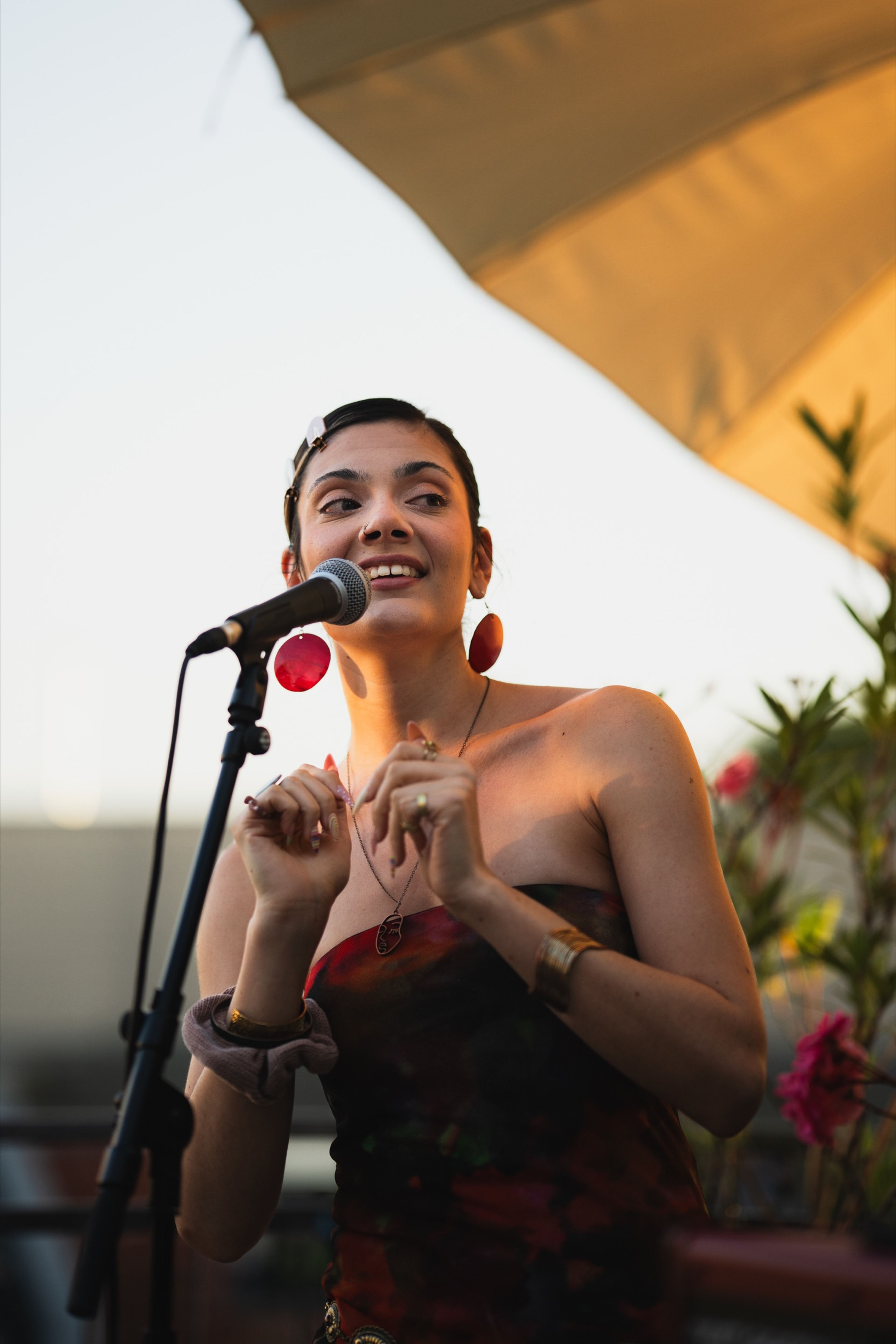Expressive vocalist mid-performance at golden hour