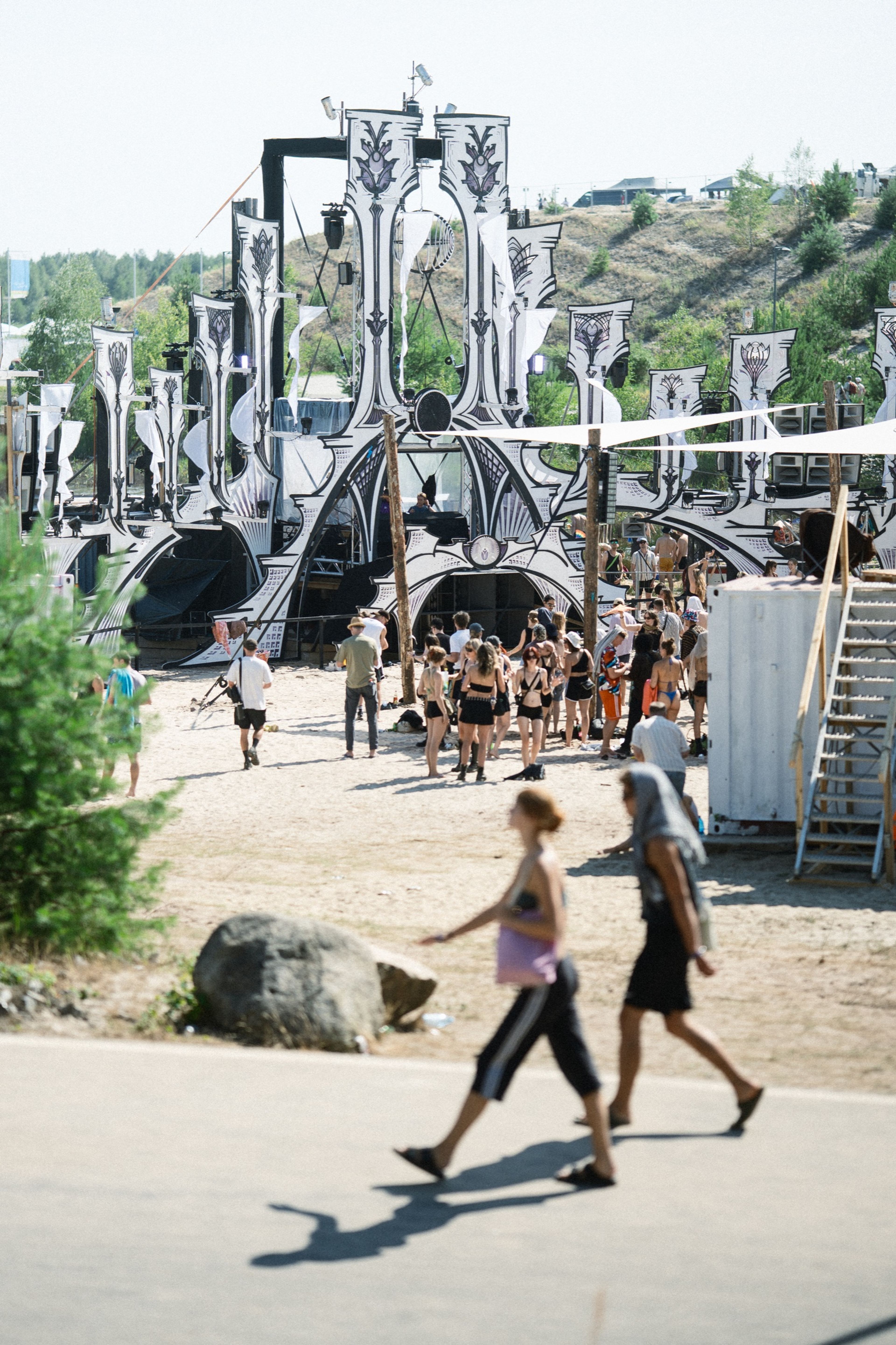 The festival's ornate black-and-white main stage rising above the crowd by day