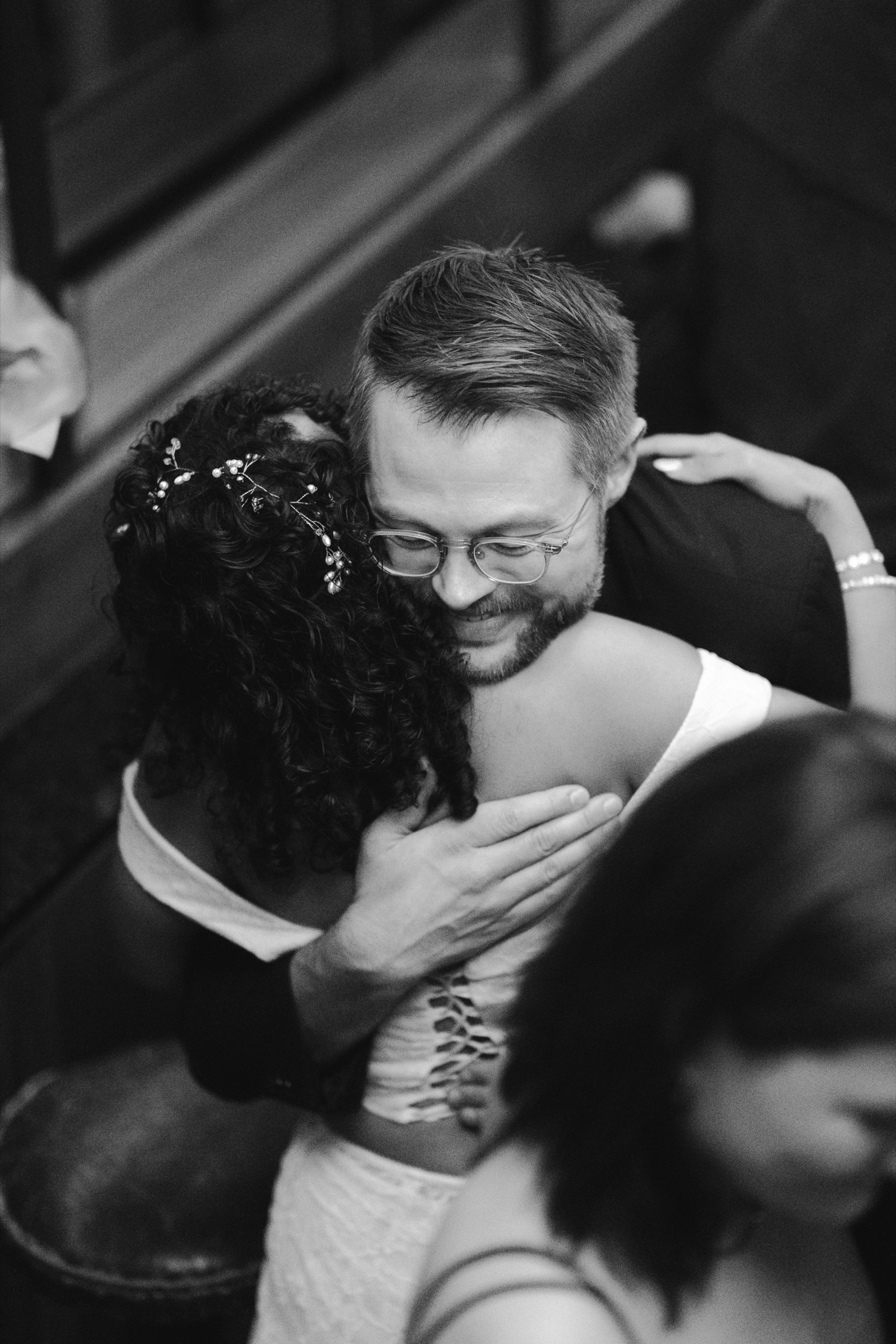 An emotional embrace between guests
