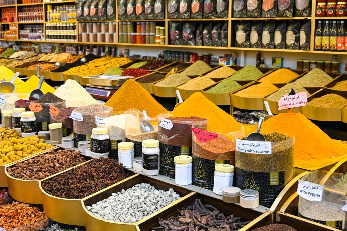 Trays of saffron, cardamom, turmeric and dried herbs piled up in the Spice Souk