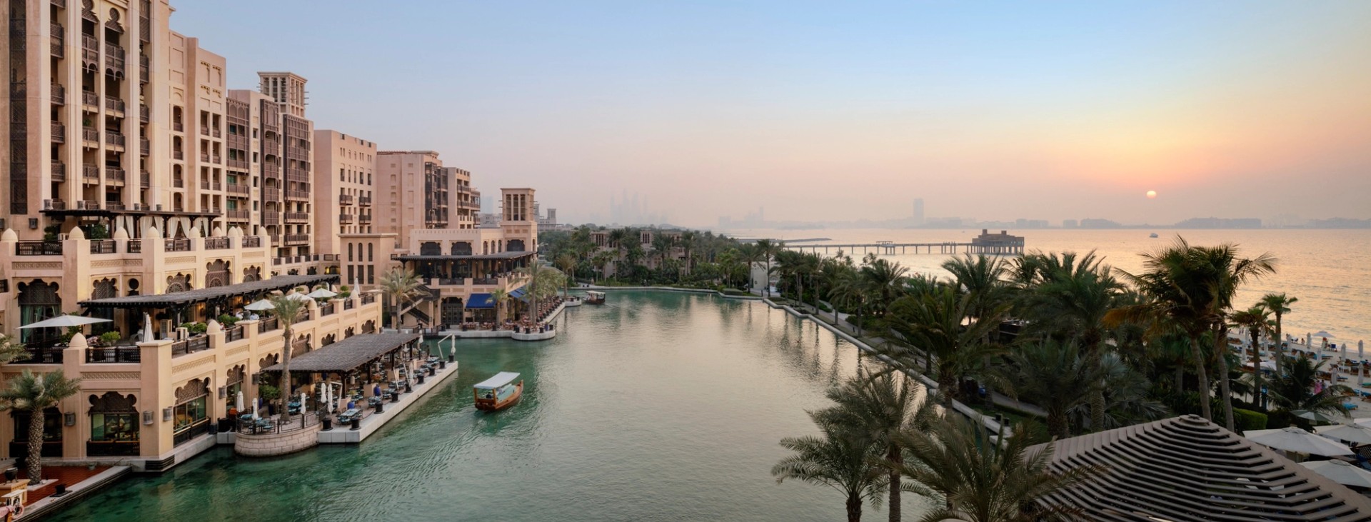 The waterways of Madinat Jumeirah at golden hour, seen from an Ocean Terrace Suite at Jumeirah Mina A'Salam