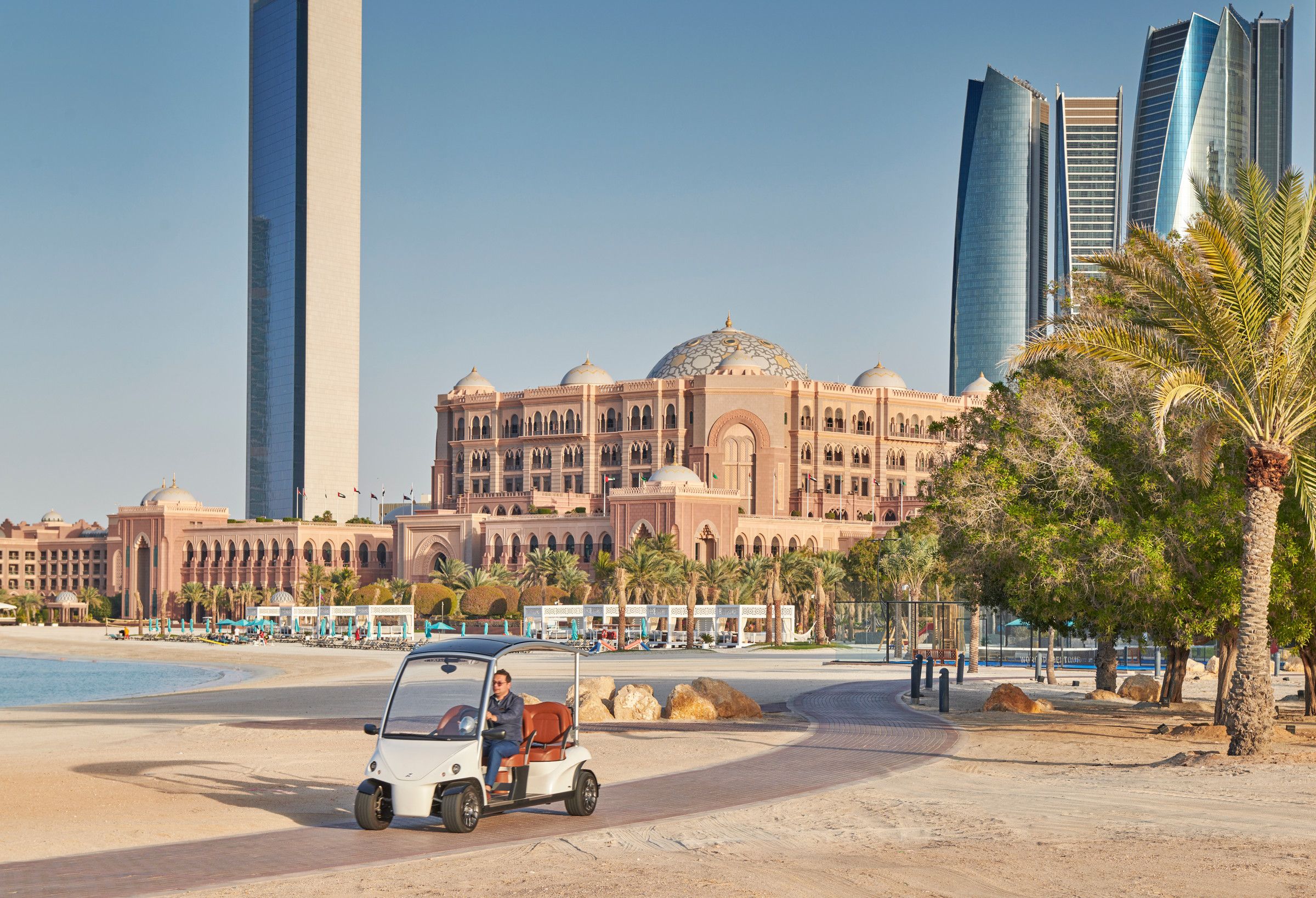 Emirates Palace on the Abu Dhabi waterfront, the city towers beyond