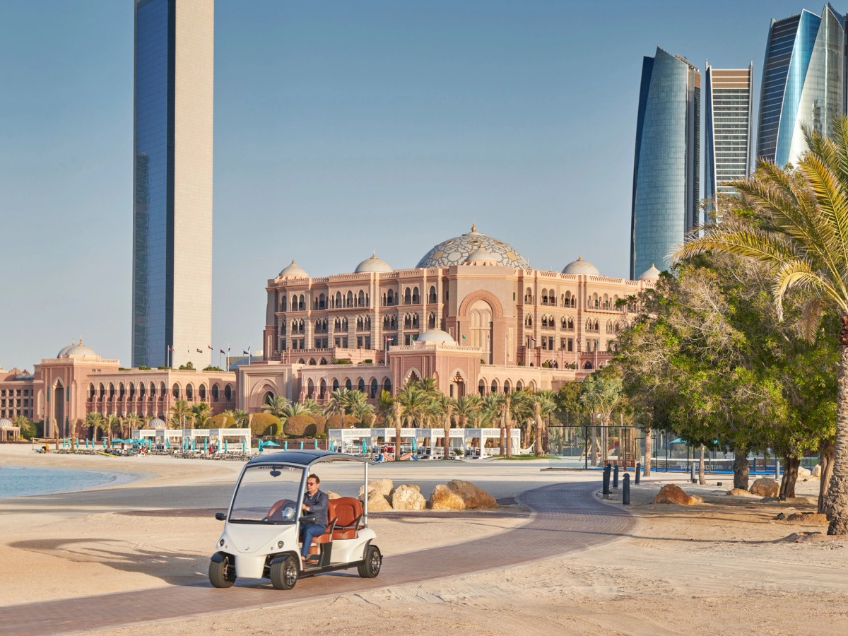 Emirates Palace on the Abu Dhabi waterfront, the city towers beyond